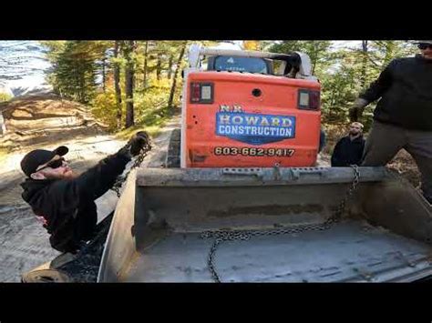 towing a stuck new holland skid steer on snow|how to move skid steer thread.